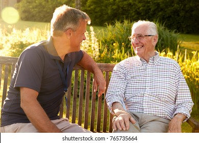 Man Visiting Senior Male Relative In Assisted Living Facility