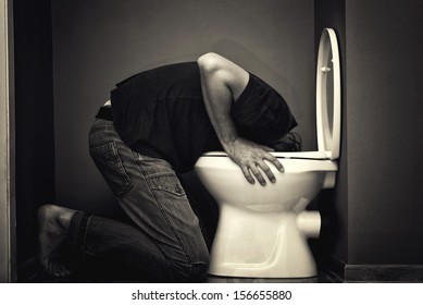 Man Vomiting In Toilet Bowl