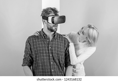 Man VR Glasses Enjoy Video Game. Girl Happy He Like Her Gift. Gift Ideas For Men. Make Him Happy Gift Him Virtual Reality Glasses And Let Play Games All Day. Best Gift Ever. Man Enjoy Virtual Reality.