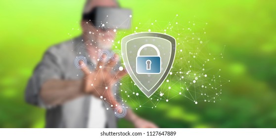 Man with vr headset touching a data security concept on a touch screen with his finger