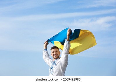 Man In Vyshyvanka With Flag Of Ukraine Outdoors