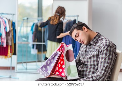 Man waiting for his wife during christmas shopping - Powered by Shutterstock