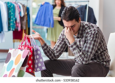 Man waiting for his wife during christmas shopping - Powered by Shutterstock