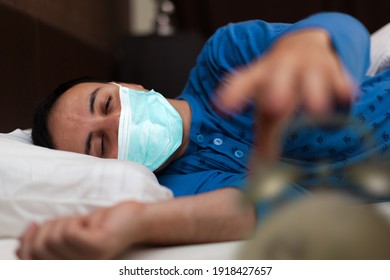 Man Waking Up While Already Wearing A Coronavirus Covid Mask, Funny Coronavirus Concept