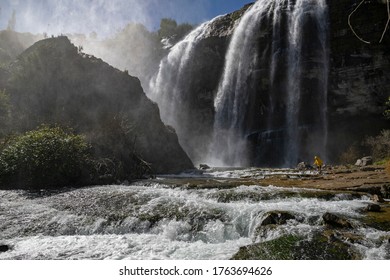 Man Walking Against The Big Waterfall In Tortum. Explore The World's Beauty And Wildlife. Man On A Great Waterfall