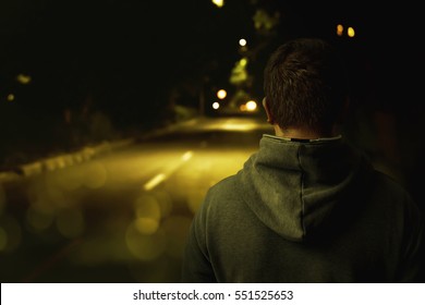 Man Walking Alone At Night