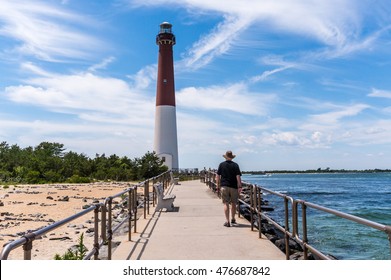 Man Walking Along Barnegat Inlet, Toward Barnegat Lighthouse