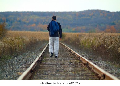 Man Walking Along Train Tracks Stock Photo 691267 | Shutterstock