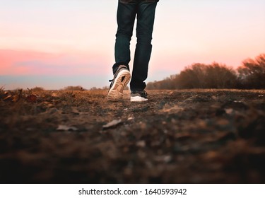 Man Walking Away In Sneakers Shoes