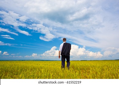 Man Walking Away Troughh The Filed