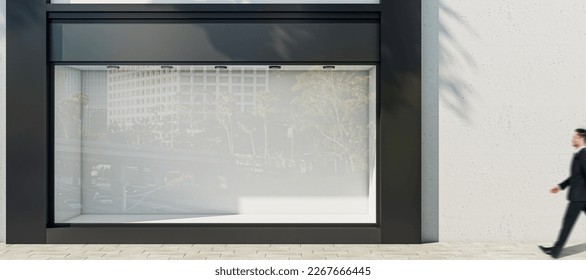 Man walking by sunlit wall background with place for your advertising poster near empty shop window with space for your product presentation in modern building area outdoors, mock up - Shutterstock ID 2267666445