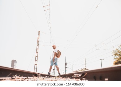 man walking by train