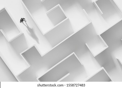 man walking in a complex white maze, surreal concept