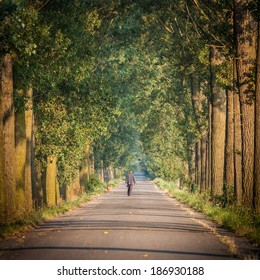 Man Walking With A Dog