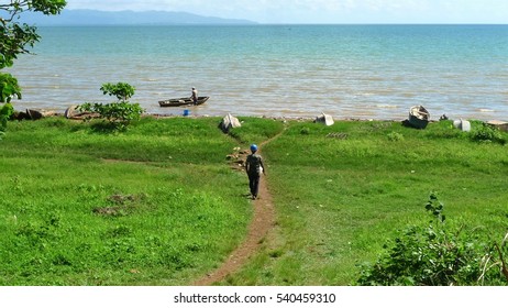 A man walking down to a beach