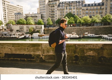 Man Walking Down The Paris Streets Near The Seine