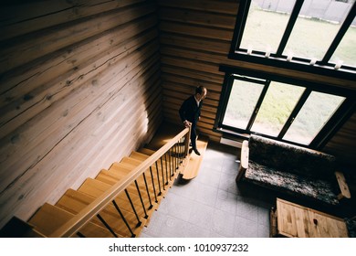 the man is walking down the stairs