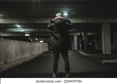 Man walking down stairwell,  posing and shooting photos - Powered by Shutterstock