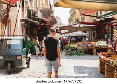 Man Walking In The Food Market Of Palermo. Wanderlust