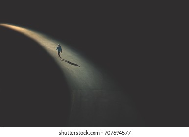 man walking in the night - Shutterstock ID 707694577
