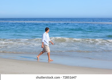 Man Walking On The Beach