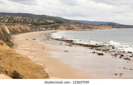 Man Walking On Beach In Crystal Cove Newport Beach California