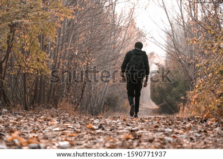 Similar – Young man running outdoors during workout in a forest