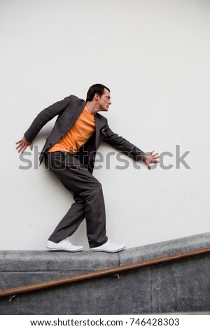 man walking on railing