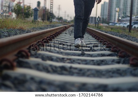Man walking on the railway, Railroad with vintage toning