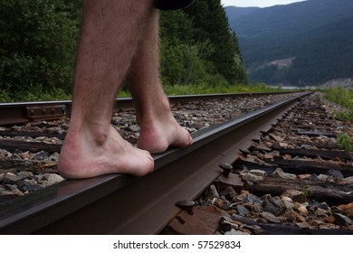 Man walking on railway track