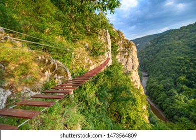 Man Walking On Via Ferrata Trail, Casa Zmeului, Romania