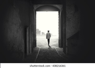 Man Walking Out From A Dark Alley