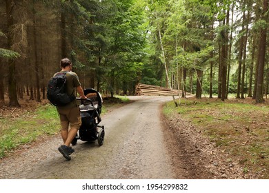 A Man Walking With A Pram. Location: Europe, Czechia, Trebenice