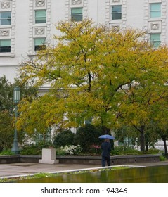 Man walking in the rain.