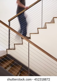 Man Walking Up Stairs In Apartment