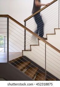 Man Walking Up Stairs In Apartment