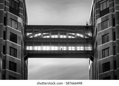 Man is walking through between modern building black and white, Abstract concept