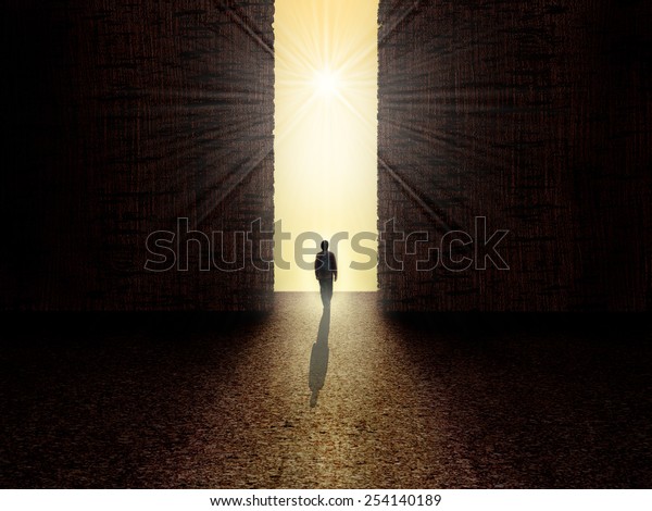 man walking towards the light