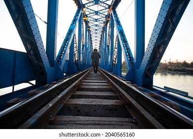 man walking in the train bridge 