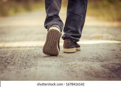 A man walks on the road