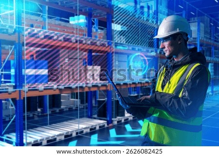 Man warehouse digitalization specialist. Programmer with laptop near rack with boxes. Warehousing software developer. Man in yellow vest in futuristic warehouse. Digitalization of storage