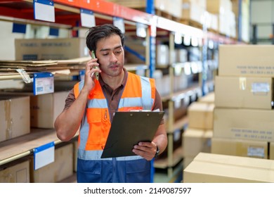 Man Warehouse Manager Using Mobile Phone Talking With Customer. Warehouse And Logistic Business Concept.