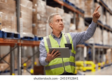 Man, warehouse and worker with tablet pointing, technology and ecommerce for import or export. Inventory, online and shipping oder in manufacturing company, supply chain with distribution employee - Powered by Shutterstock