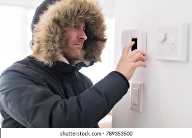 Man With Warm Clothing Feeling The Cold Inside House