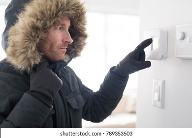 Man With Warm Clothing Feeling The Cold Inside House