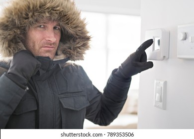 Man With Warm Clothing Feeling The Cold Inside House