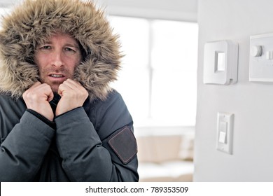 Man With Warm Clothing Feeling The Cold Inside House