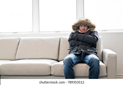Man With Warm Clothing Feeling The Cold Inside House on the sofa