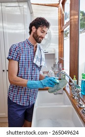 Man Washing Dishes Cleaning Kitchen At Home