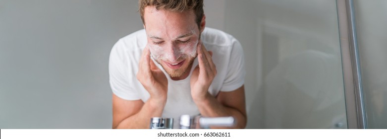 Man Washing Face Banner Panorama. Person Cleansing With Facial Cleanser Face Wash Soap In Bathroom Sink At Home.